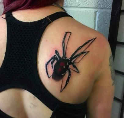 Black widow spider tattoo on the upper back, with red detailing on the abdomen.